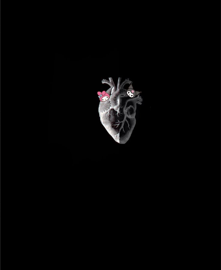 a heart shaped object in the dark with flowers on it's head and eyes