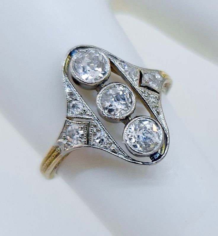 Thank you for viewing this beautiful antique Edwardian 1910's 14k & platinum  diamond ring.  The ring contains 9 diamonds weighting between .60 and .70 carats.  The diamonds are an average quality of H color SI clarity.  The ring size is 4.25.  The weight of the ring is 2.1 grams.  The ring comes with an attractive gift box. Platinum Diamond Ring, Antique Jewelry Rings, Platinum Diamond Rings, Ring Pictures, Modern Jewelry, Rings Statement, Vintage Watches, Antique Jewelry, Favorite Jewelry