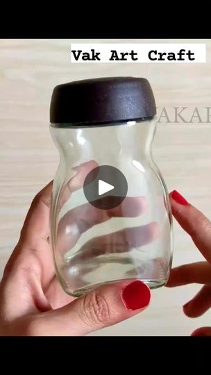 a person holding a glass jar with an american flag painted on the inside and bottom