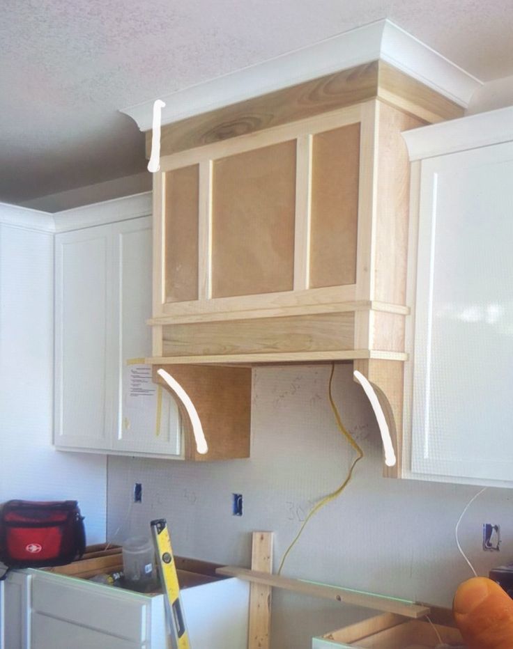 the kitchen cabinets are being installed in order to make it look like they have been built