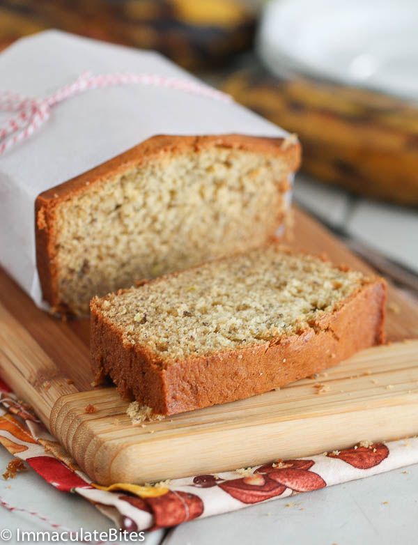 a loaf of banana bread sitting on top of a cutting board