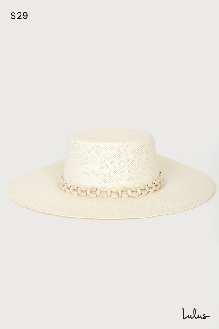 Enjoy the view of the ocean waves with the Lulus Beach Daze Cream Beaded Boater Hat! This cute sun hat is composed of lightweight, woven straw that shapes a boater silhouette with a high crown, flat top, and a wide floppy brim. Smooth wood-look beads accent the band for a vacay feel! 4" soft brim. 23" interior circumference with an internal drawstring. Crown measures 4" tall. 100% Paper. Gentle Wash. Hang Dry. Imported. Lulus | Beach Daze Cream Beaded Boater Hat. Cute Sun, Boater Hat, Woven Paper, Flats Top, Ocean Waves, Sun Hat, The View, Wedding Shop, Sun Hats