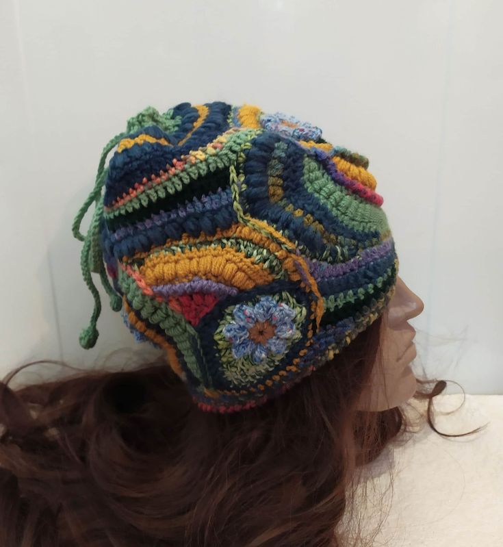 "A soft warm crochet  multicolor ( yellow, blue, green) Women  beanie hat  in boho style. This hat  made in a unique pattern that cannot be repeated exactly. Perhaps an approximate repetition.  This is a flight of fantasy and intuitive knitting. In this knitted set you will be unique, irresistible and delightful. This hat has no seam and you can turn it in any way and change your look.   This Beanie is sure to be the perfect accessory for your fall and winter wardrobe. It is stylish, functional, Handmade Multicolor Casual Bonnet, Casual Handmade Multicolor Bonnet, Adjustable Multicolor Whimsical Crochet Hat, Yellow Yarn Crochet Beanie Hat, Yellow Hand Knitted Beanie Crochet Hat, Multicolor Bohemian Knitted Beanie, Hand Knitted Yellow Crochet Hat, Yellow Yarn Crochet Hat, Multicolor Hand Knitted Bonnet