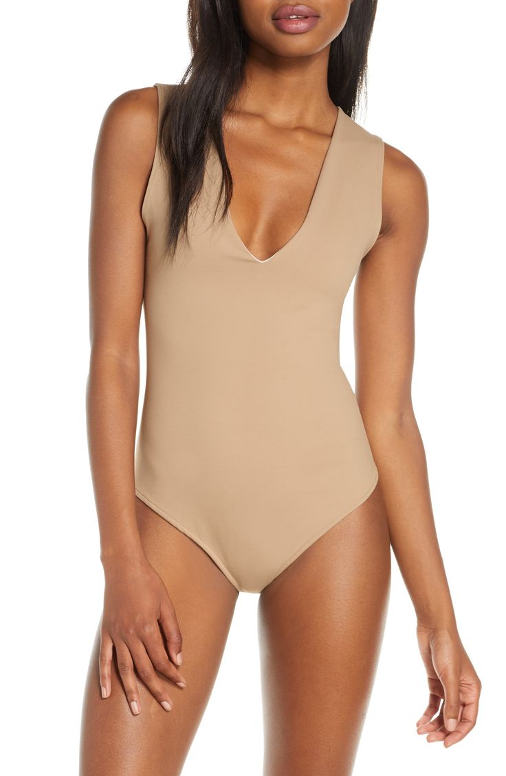 Wide straps frame this sleek and shapely bodysuit designed with a perfectly dipped neckline. V-neck Sleeveless Partially lined 88% nylon, 12% spandex Hand wash, line dry Made in the USA or imported Lingerie Sleeveless Sleek Smoothing Bodysuit, Sleek Sleeveless Bodysuit For Spring, Elegant Smoothing Bodysuit For Summer, Elegant Summer Smoothing Bodysuit, Elegant Smoothing Summer Bodysuit, Chic Second-skin V-neck Swimwear, Summer V-neck Smoothing Bodysuit, Chic Sleeveless Bodysuit With Lined Body, Sleek Spring Bodysuit With Lined Body