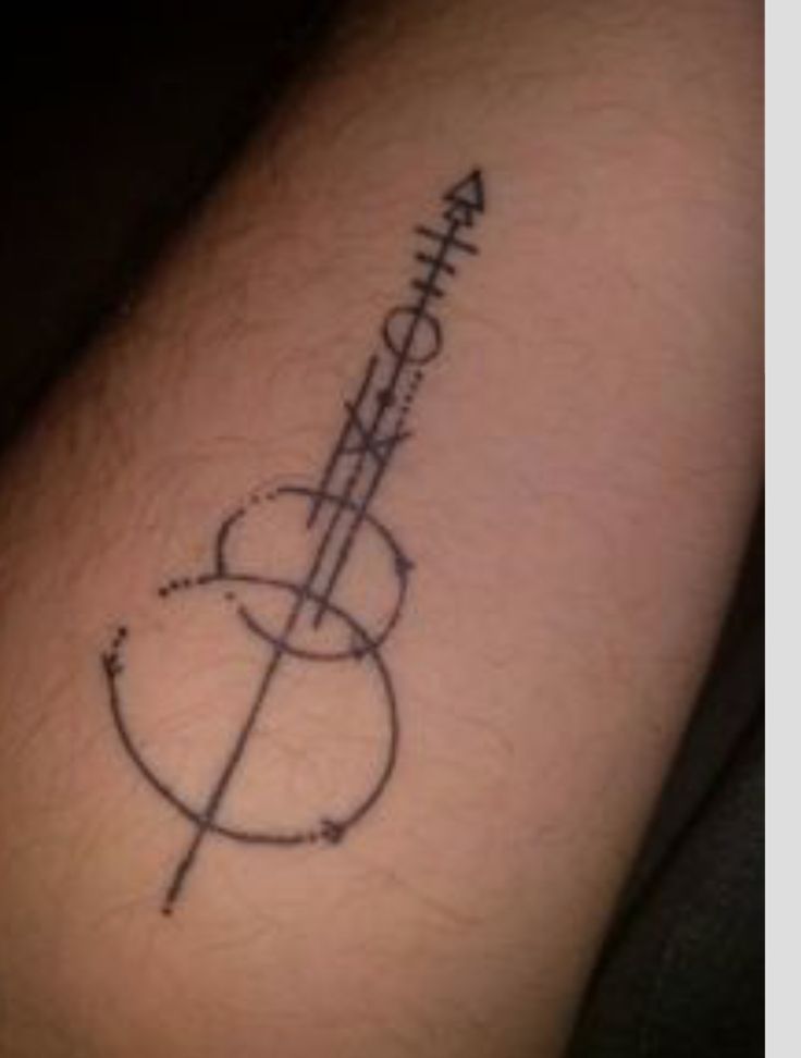 a man's arm with a tattoo on it that reads, faith and an arrow