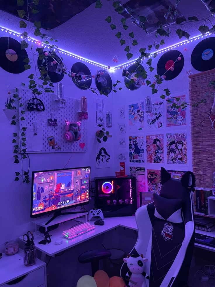 a computer desk with a monitor, keyboard and mouse in front of a purple light