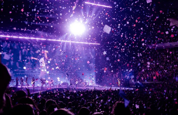 confetti is thrown in the air at a concert