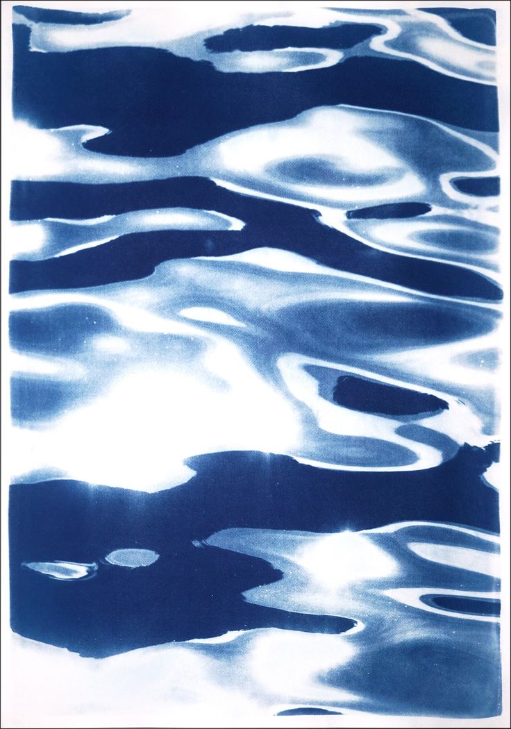 the water is blue and white with black spots