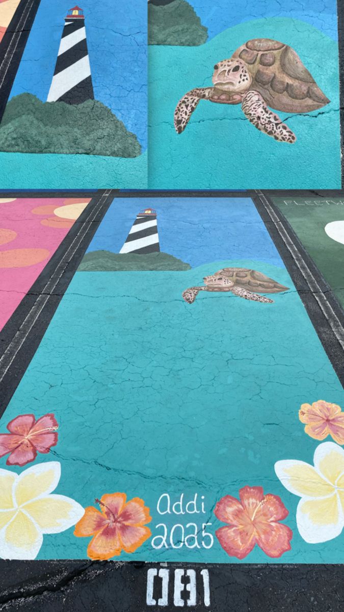 a turtle painted on the side of a road with flowers and lighthouses in the background