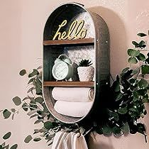 a wall mounted shelf with towels and plants