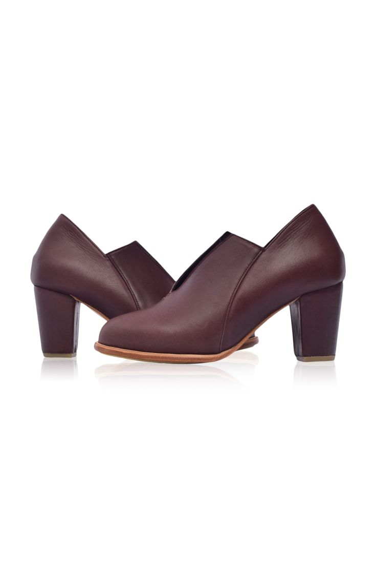 The Ange ankle booties are a must-have for your desk-to-dinner look with the below-ankle height design and leather-wrapped heel. Handcrafted in a timeless silhouette, neutral hues, and almond-shaped toe, these booties are comfortable and chic enough to become your favourite pair for any occasion. Wear them with your mini or midi dress to elevate your everyday casual look or with your skinny jeans for a super chic style. 100% genuine leather Smooth leather lining and insole with embossed logo Lig Chic High Heel Boots With Wooden Heel, Chic Boots With Wooden Block Heel, Formal Pointed Toe Booties With Stacked Heel, Workwear Ankle Boots With Stacked Heel, Elegant Pointed Toe Booties With Stacked Heel, Elegant Booties With Stacked Heel And Pointed Toe, Business Heeled Boots With Sculpted Heel, Formal Booties With Sculpted Heel And Pointed Toe, Fall Office Booties With Closed Toe