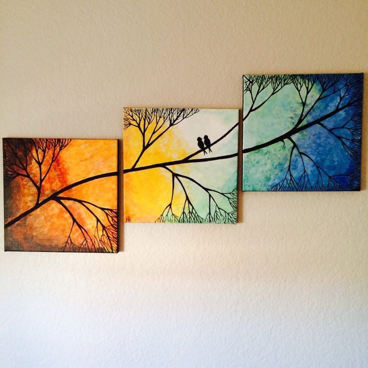 three paintings hanging on the wall with birds perched on tree branches in front of them