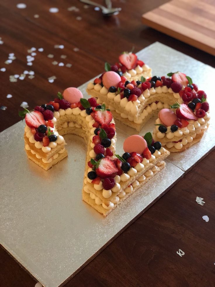 a cake shaped like the letter e on top of a table