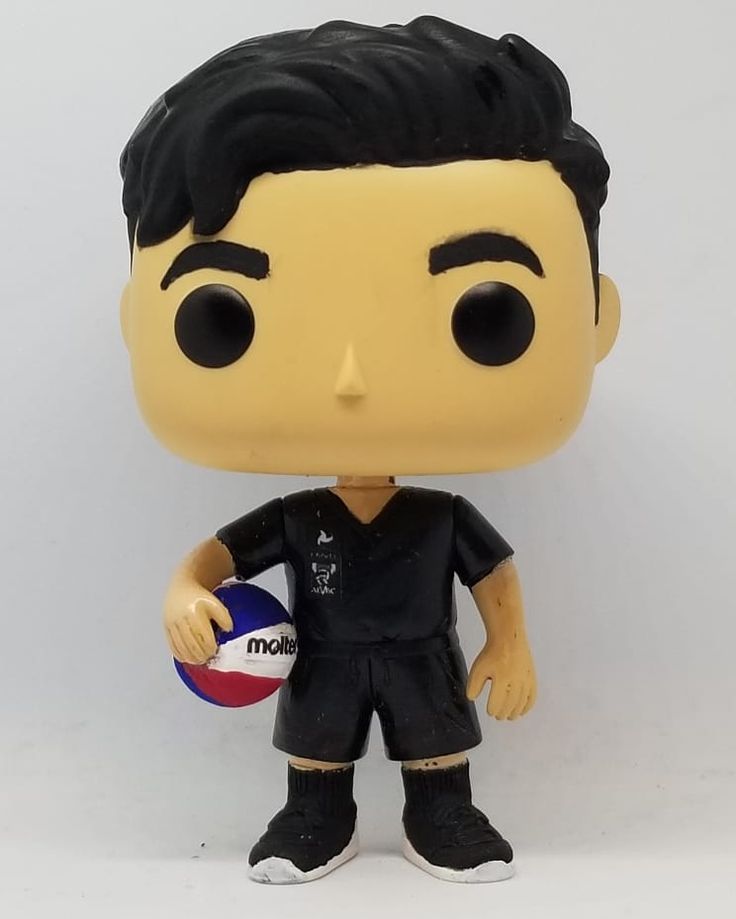 a close up of a pop vinyl figure holding a ball