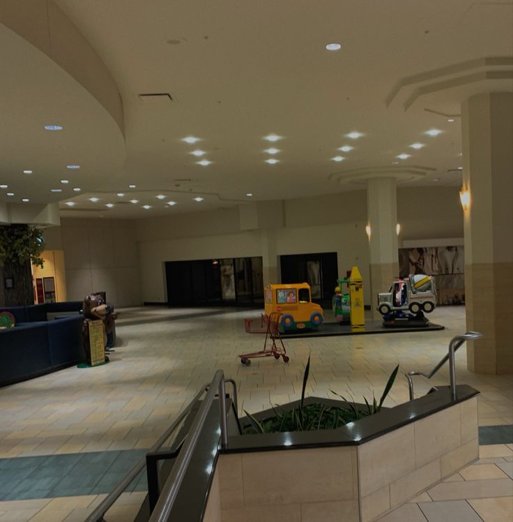 an empty lobby with children's toys in the background