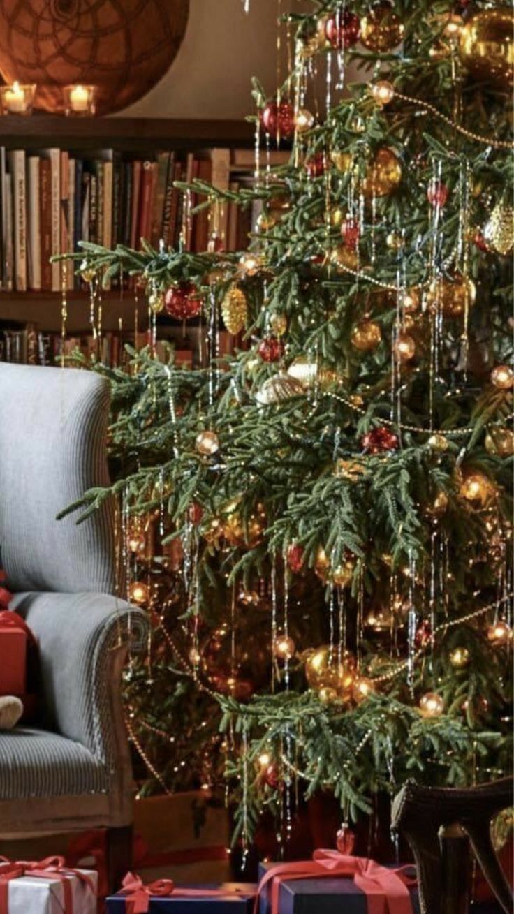 a christmas tree with presents under it