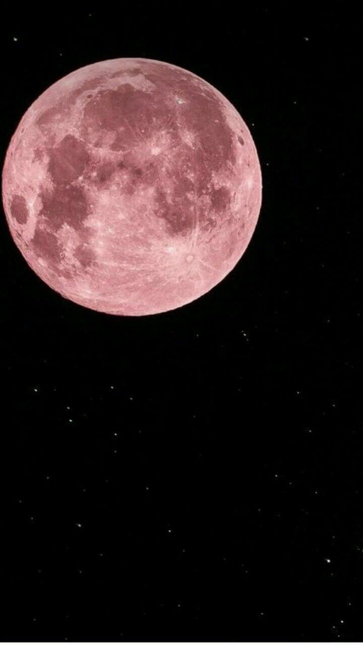 an image of a pink moon in the night sky