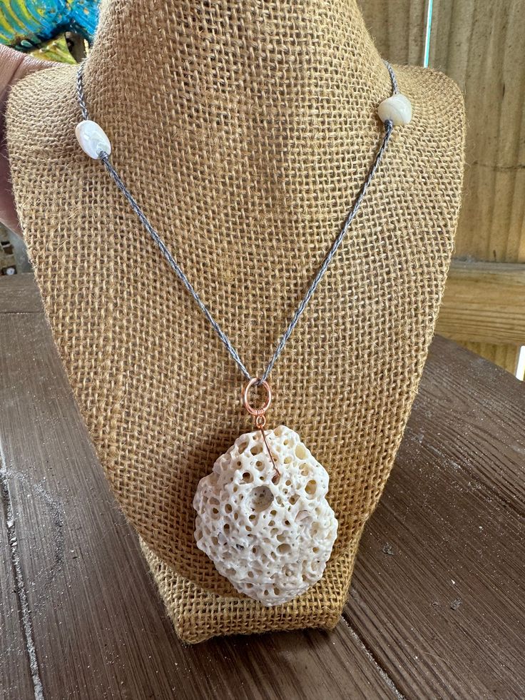 Gorgeous necklace pendant with rose gold clasps.  This little piece of treasure was found on the Gulf Coast of  Sanibel florida.  The braided chain is handcrafted out of ocean safe sustainable line making each piece extremely durable.  white shell beads accents the piece beautifully Bring this treasure home today! Authentic weathered shell was used to make this unique pendant  great gift! comes with location coordination  9.5" drop from clasp and 2 inch shell giving this piece a total 11.5" drop from clasp White Shell Artisan Jewelry, Unique White Shell Pendant Necklace, Unique White Pendant Shell Necklace, White Shell Necklaces With Lobster Clasp, White Pendant Shell Necklace With Lobster Clasp, White Artisan Shell Jewelry, White Wire Wrapped Jewelry For Beach, Artisan White Shell Jewelry, White Pearl Pendant Jewelry For Beach