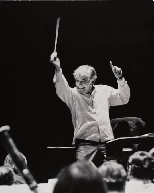 an old black and white photo of a conductor