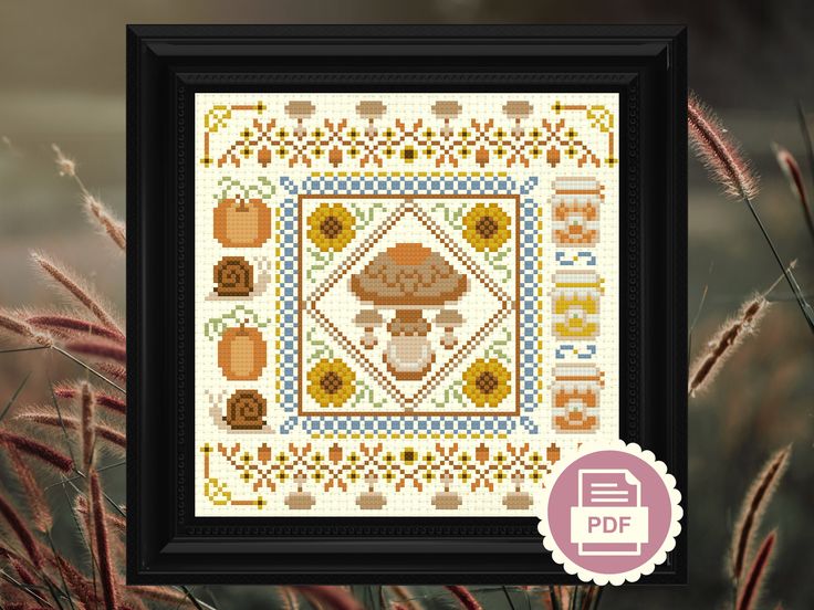 a cross - stitch pattern with an animal and flowers in the center, on a black frame