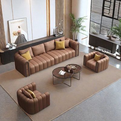 a living room with couches, chairs and tables in front of a large window