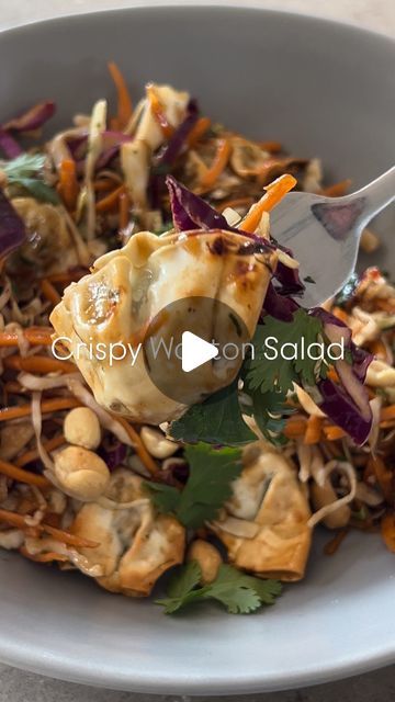 a white bowl filled with food on top of a table