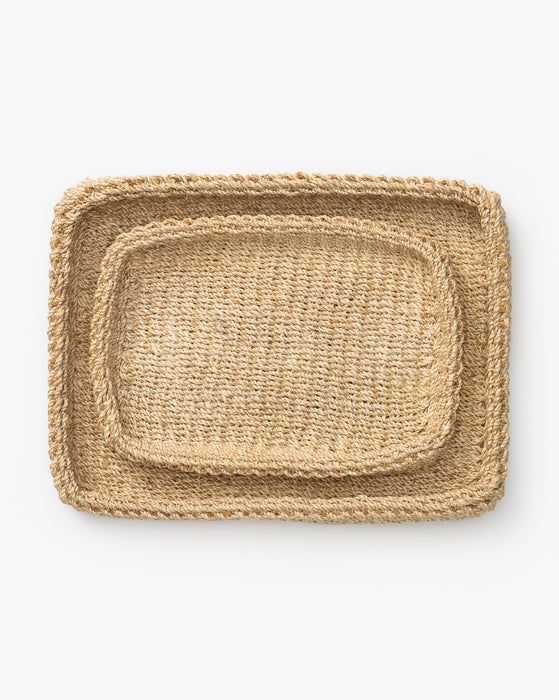 an oval woven placemat on a white background with no one in it or someone else