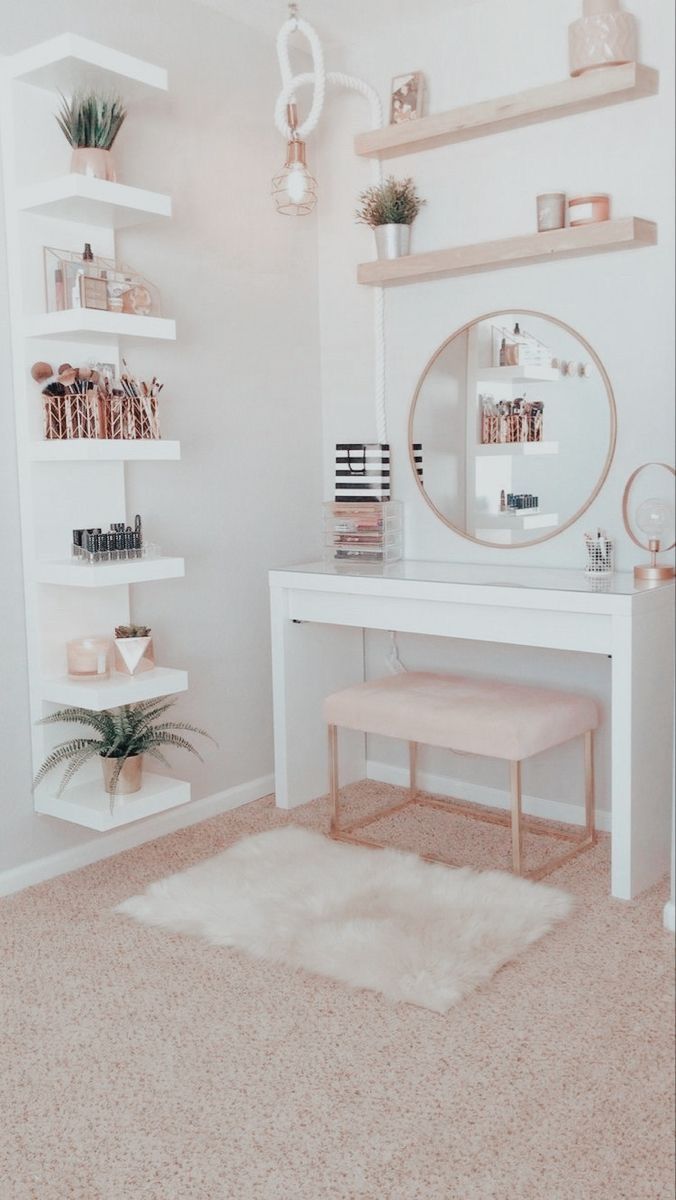 a white desk with a mirror and shelves