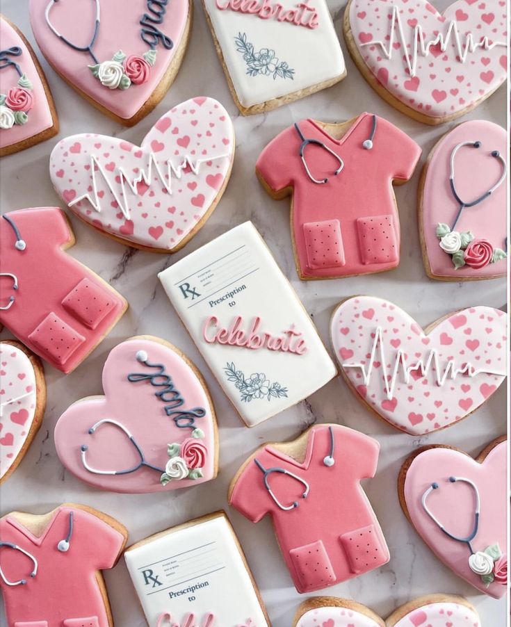 decorated cookies are arranged in the shape of hearts