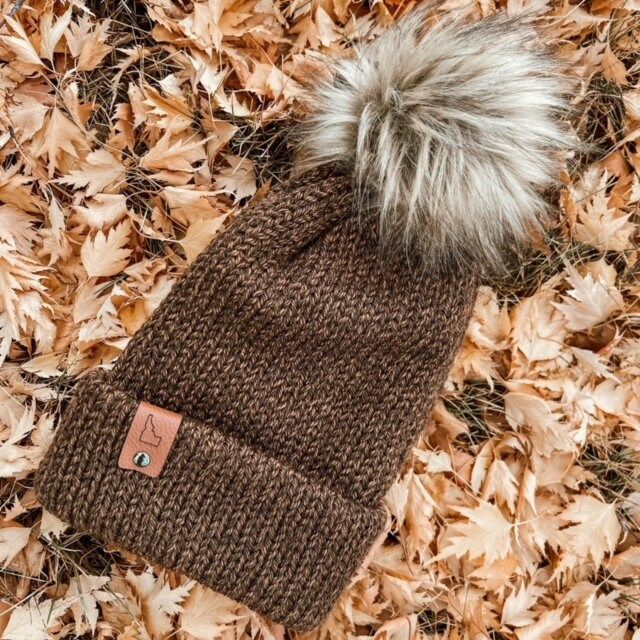 Wonderful knitted winter hats.  Perfect adult hat for warmth, comfort, and style.  This hat makes a practical and unique gift.  Complete with a leather tag and a pom pom.  Choose your favorite color and tag. Warm Brown Hats For Outdoor, Warm Brown Hat For Outdoor, Adjustable Brown Beanie For Winter, Outdoor Brown Winter Hats, Adjustable Cozy Brown Hat, Brown Beanie For Cold Weather In Fall, Warm Crochet Hat For Outdoor Fall Activities, Warm Crochet Hat For Outdoor Fall Use, Brown Soft Knit Beanie For Fall