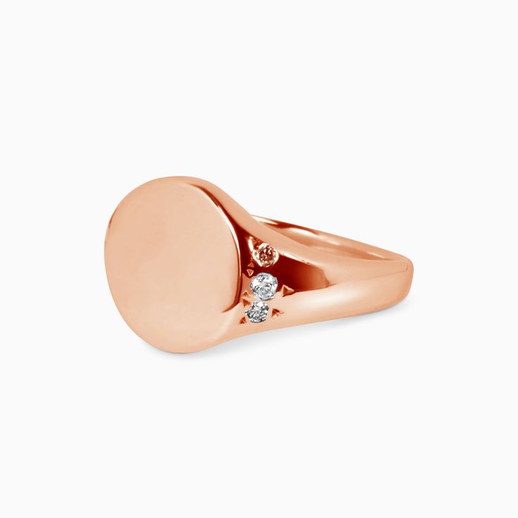 This petite classic Signet Ring makes a statement. The ring surface is a 10x10mm circle, domed on either side with small diamond accents. The signet ring has been used throughout history and across cultures to showcase family crests and position in society. For an added touch, include details for a complimentary monogram or symbol in your notes upon check out. All monograms and symbols are hand-engraved by Brooklyn Engravings. Before your signet ring is hand engraved an email will be sent to you Luxury Oval Rose Gold Signet Ring, Elegant Rounded Signet Ring For Anniversary, Elegant Anniversary Signet Ring With Rounded Shape, Luxury Rose Gold Oval Signet Ring, Timeless Wedding Signet Ring, Elegant Anniversary Signet Ring, Sterling Silver Signet Ring With Diamond Accents, Formal Oval Rose Gold Signet Ring, Elegant Oval Rose Gold Signet Ring