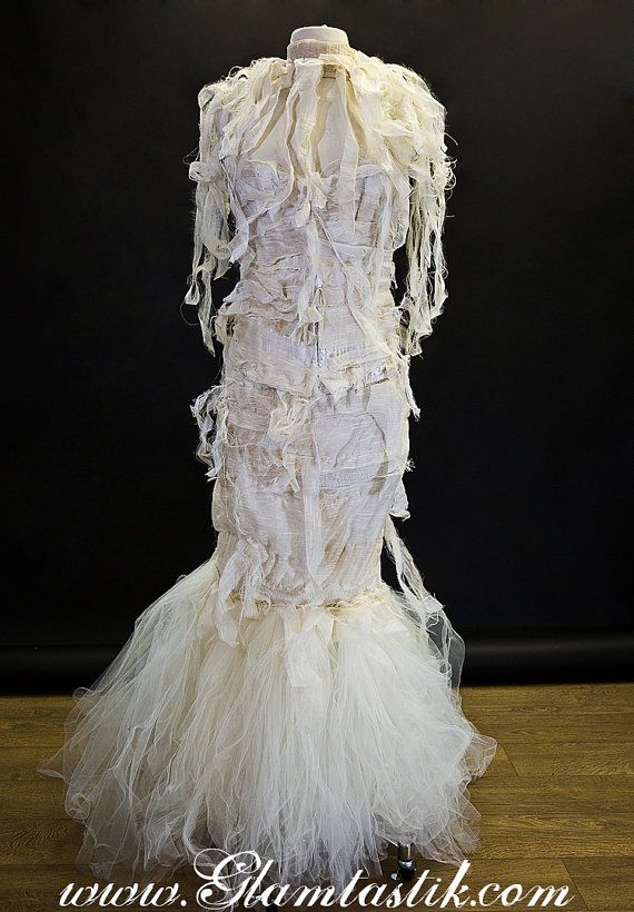 a dress made out of fabric and feathers