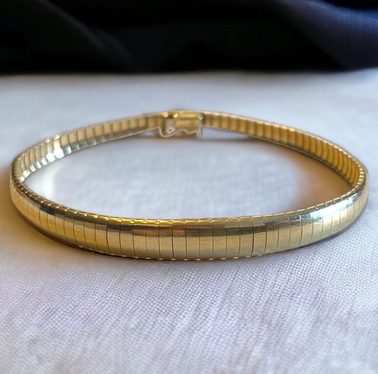 "Beautiful 14k Italian Yellow Gold Graduated OMEGA 7.25\" Vintage Bracelet! A very beautiful Omega bracelet! In excellent vintage condition! * Expertly crafted in solid 14k (585) yellow gold * Graduated width from approximately 3mm width to 6mm * Measures approximately 7.25\" * Secure box closure * Hallmarked 14k * Weighs 9.6 grams Shipped FAST and FREE, in a gift box fully insured :) I guarantee item to be exactly as described and pictured." Vintage Gold Bracelet With Polished Finish, Vintage Jubilee Tennis Bracelet For Formal Occasions, Vintage Gold Bracelet With Polished Finish For Formal Occasions, Retro Yellow Gold Bracelet For Formal Occasions, Retro Yellow Gold Bracelets For Formal Occasions, Vintage Jubilee Tennis Bracelet For Anniversary, Vintage 14k Gold Stamped Bracelets For Anniversary, Vintage Tennis Bracelet With 17 Jewels As Gift, Vintage 14k Gold Anniversary Bracelet