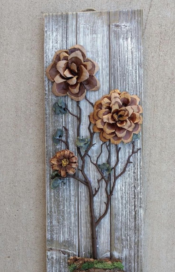 a piece of wood with flowers on it