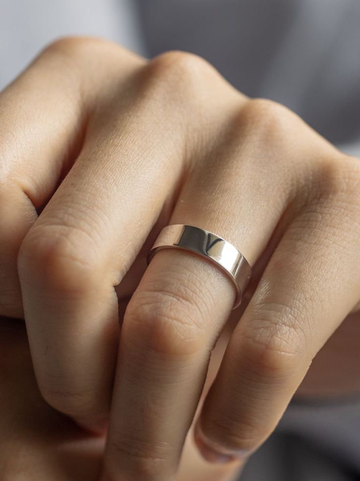 a woman's hand with a ring on it