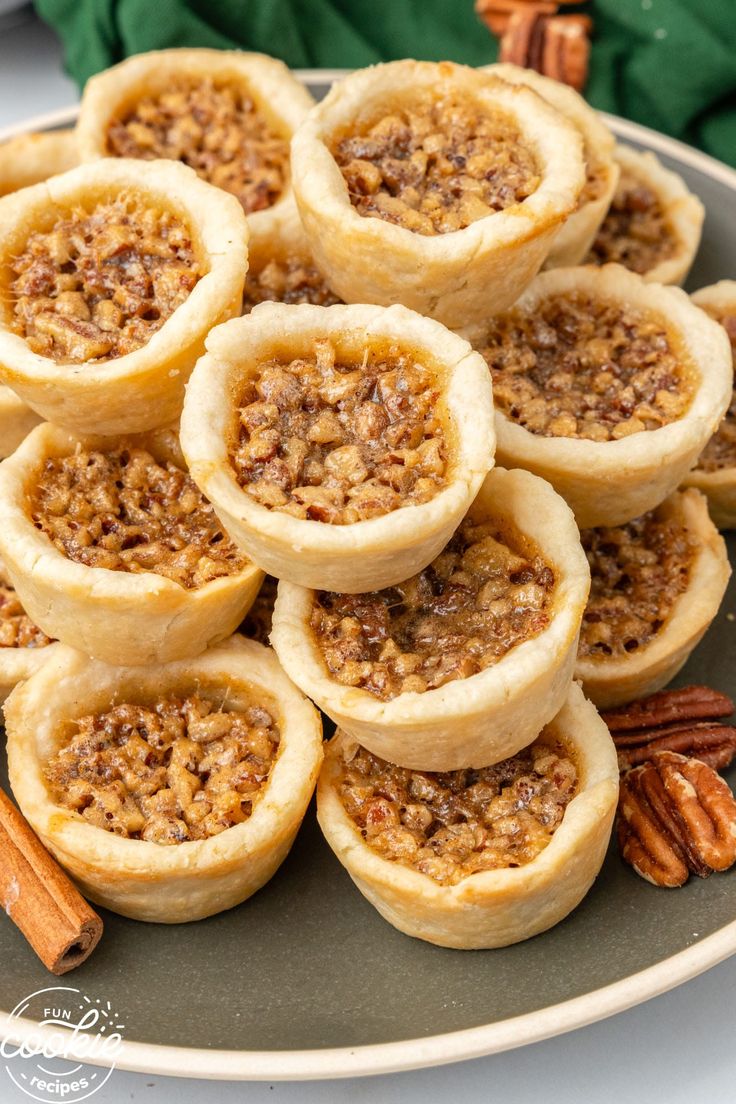 several pecan pies are arranged on a plate