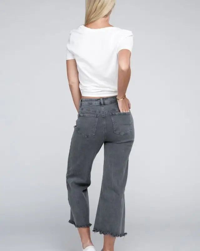 Elevate your denim game with our Acid Washed High Waist Frayed Hem Straight Pants. The high waist design not only adds a trendy touch but also ensures a flattering fit. Crafted from denim with a good stretch, they provide exceptional comfort for all-day wear. The zip fly and back pockets offer both functionality and fashion, making these pants a practical choice for any occasion. With their frayed hem and straight wide leg, these pants are a must-have addition to your wardrobe, delivering a mode High Waist Cropped Jeans With Frayed Hem For Fall, Fall High Waist Cropped Jeans With Frayed Hem, Wide Leg Jeans With Frayed Hem For Day Out, Straight Leg Jeans With Frayed Hem For Casual Wear, Trendy High Rise Cropped Jeans For Day Out, Trendy High-rise Cropped Jeans For Day Out, Relaxed Fit Straight Leg Flare Jeans For Day Out, Relaxed Fit Flare Jeans For Day Out, Dark Wash Cropped Bottoms With Five Pockets