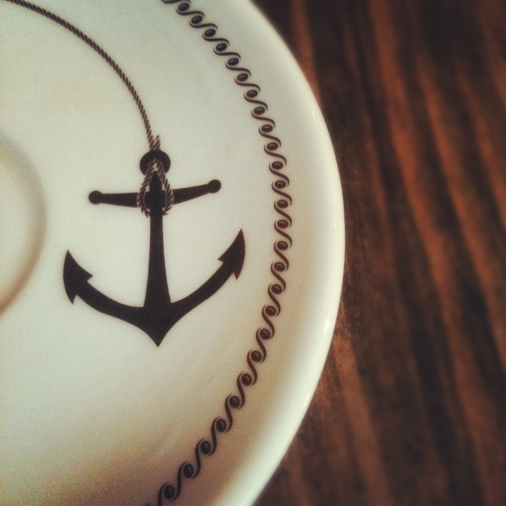 a white plate with an anchor drawn on it