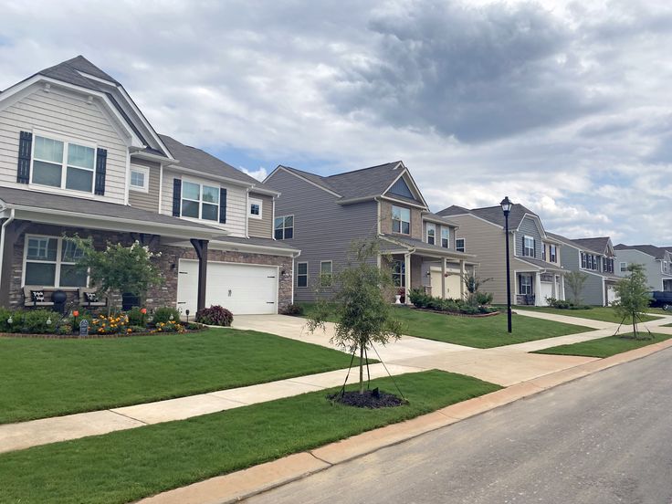 a row of houses with grass in front of them