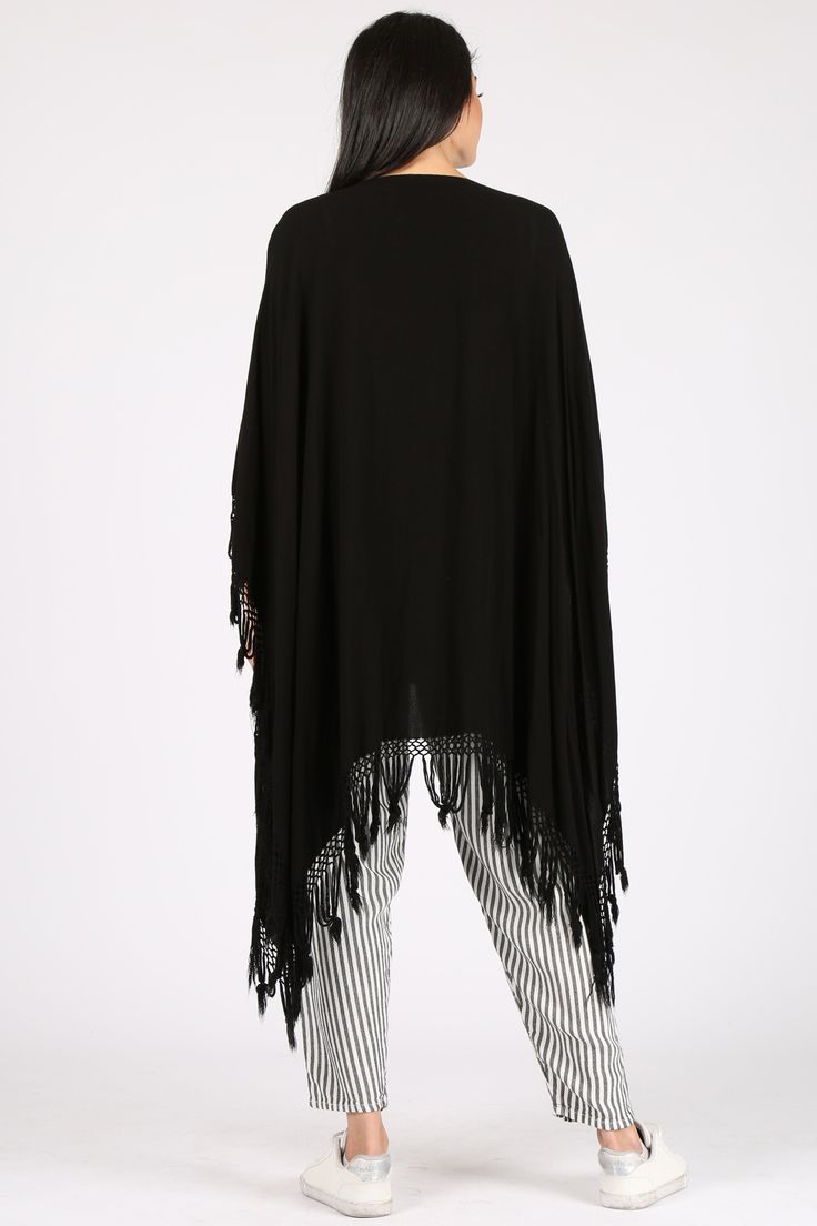 A light take on the poncho, this versatile piece can also act as a shawl and beach coverup. Please note this style is unisex. Fabric Content: 60% Cotton, 40% Rayon, made in Morocco. Sizing: O/S Casual Beach Shawl For Summer, Casual Summer Shawl For Beach, Casual Summer Beach Shawl, Spring Beach Shawl Poncho, Black Beach Poncho One Size, Bohemian Shawl For Beach In Summer, Bohemian Shawl For Summer Beach, Bohemian Shawl For Summer Beach Outing, Black One Size Beach Poncho