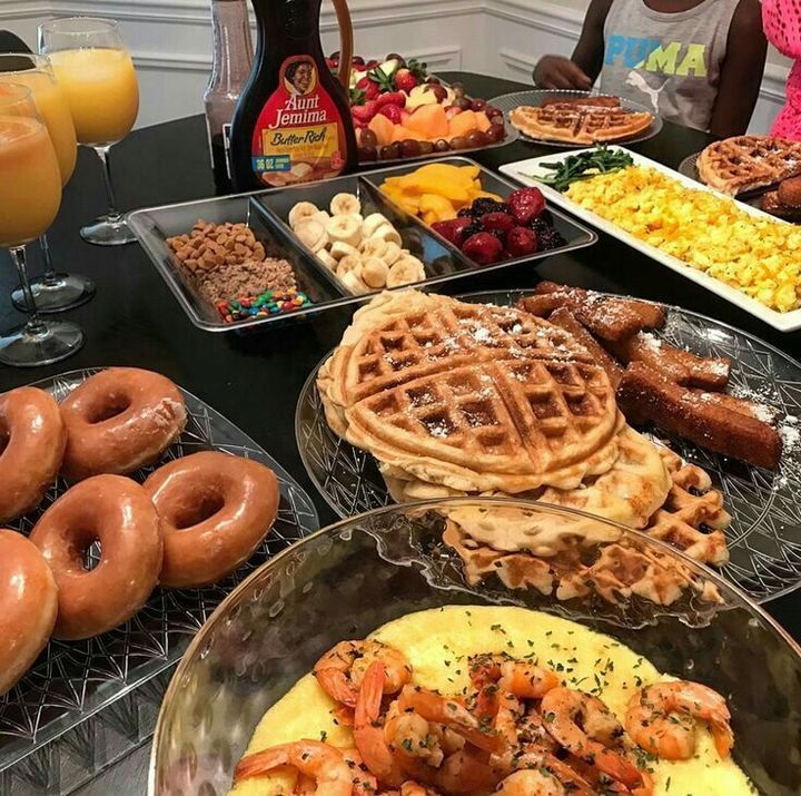 a table filled with different types of breakfast foods