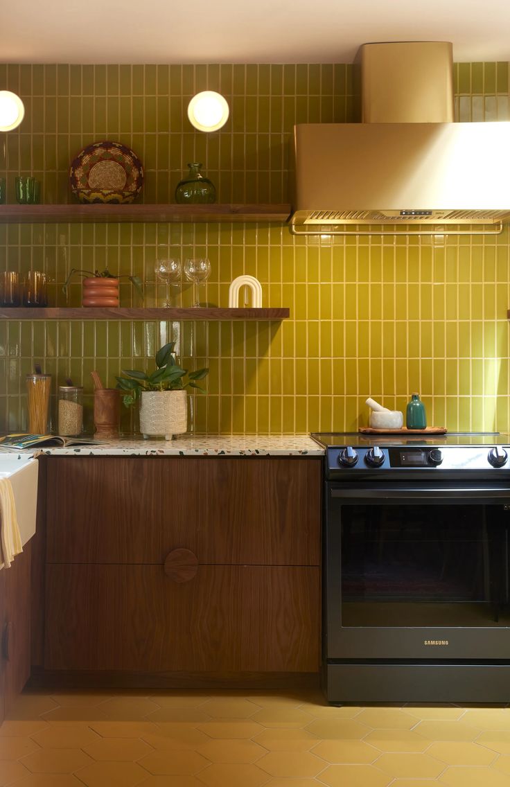 a stove top oven sitting inside of a kitchen