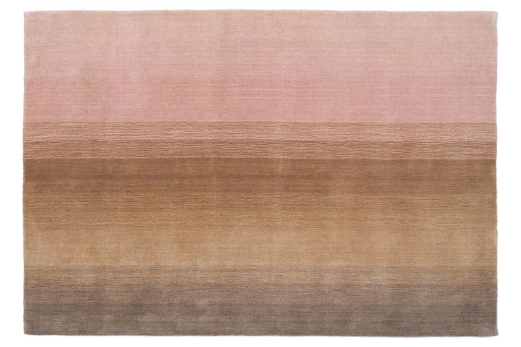 an area rug with different shades of pink and brown