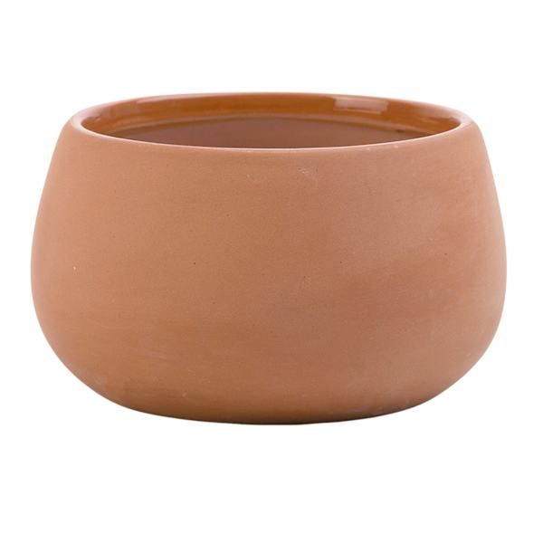 a brown ceramic bowl on a white background