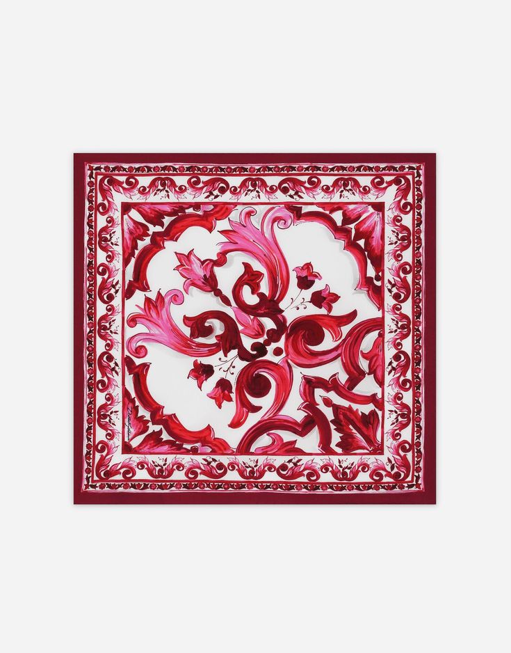 a red and white square scarf with an ornate design