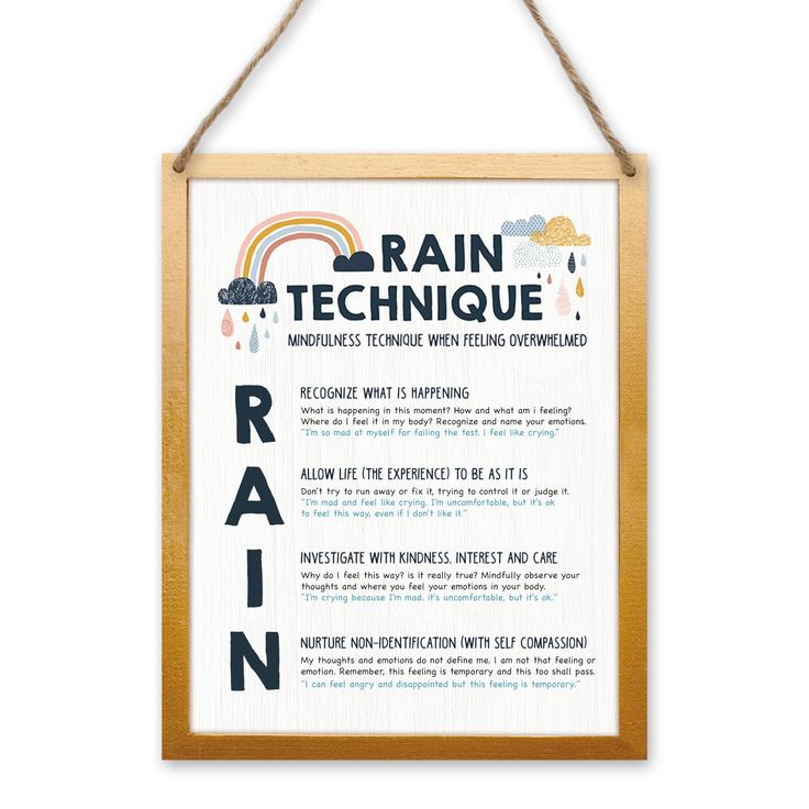 a wooden sign that says rain technique with rainbows and clouds on it hanging from a rope