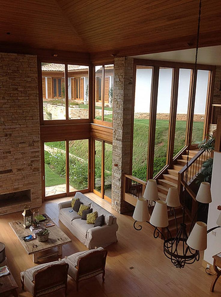 a living room filled with furniture and windows