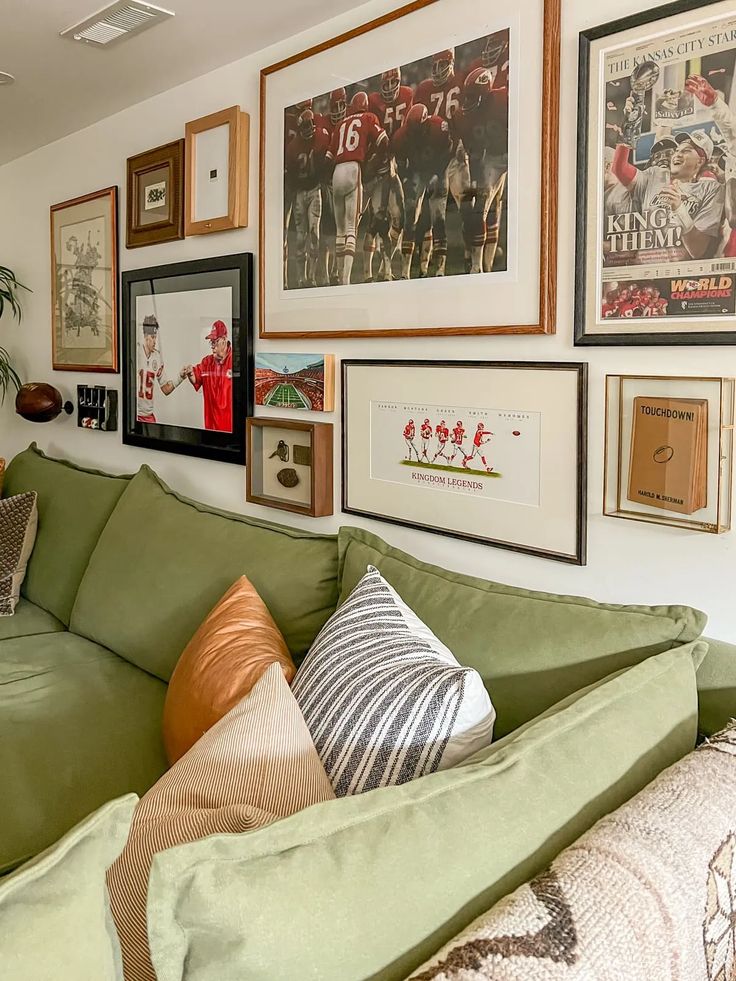 a living room filled with furniture and pictures on the wall above it's couch