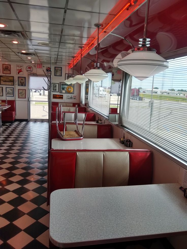 the interior of a diner with checkered flooring