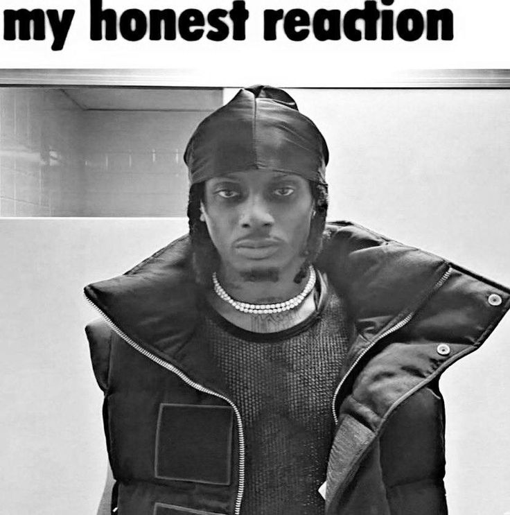 a black and white photo of a man in a jacket with the words my honest reaction on it